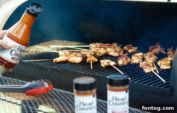 Tender Gluten-Free BBQ Chicken Kebabs 5 Ingredients laid out for barbecue chicken skewers, including chicken, barbecue sauce, and skewer sticks.