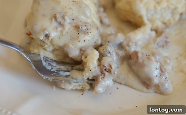 A family enjoying a slow Saturday morning breakfast, with a plate of Gluten-Free Turkey Sausage Gravy and biscuits in the foreground, evoking warmth and togetherness.