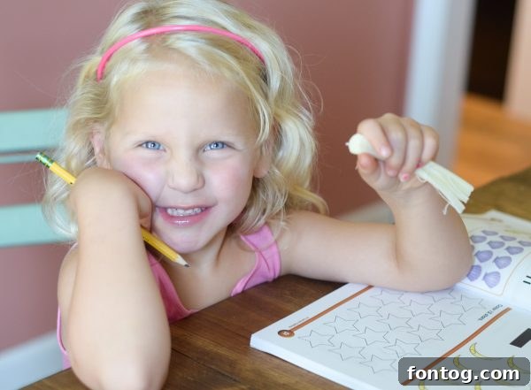Post-School Power Snacks 6 Young girl enjoying Disney Frozen String Cheese while doing homework