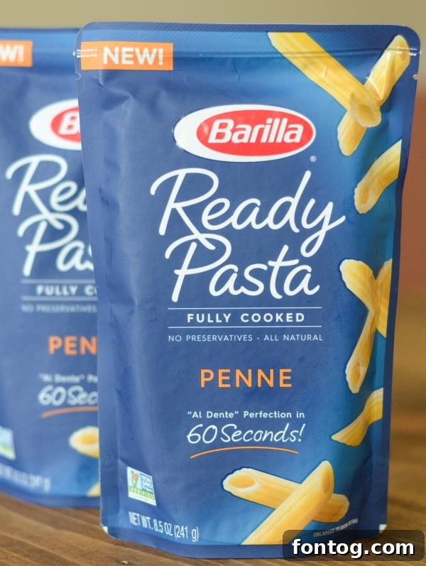 Close-up of a refreshing Chicken Salad Pasta Bowl with fresh ingredients.