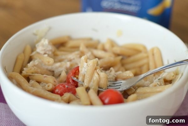 Close-up of the delightful Chicken Salad Pasta Bowl with fresh herbs.