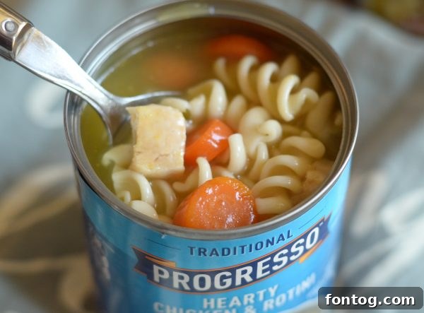 Close-up of cornbread topped soup in a jar, showcasing texture