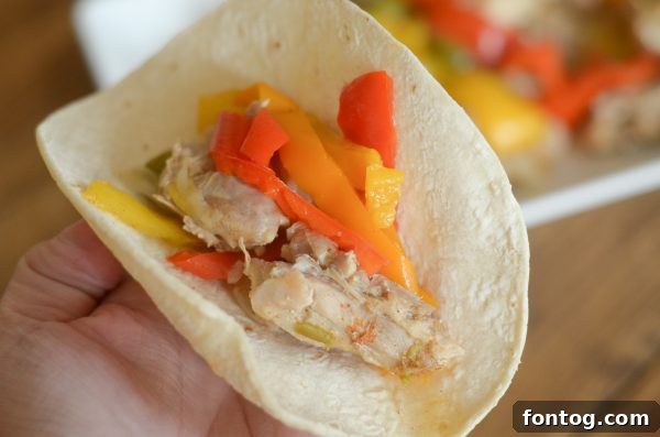Effortless Instant Pot Chicken Fajitas 4 Instant Pot Chicken Fajitas - cooked chicken and veggies with spices