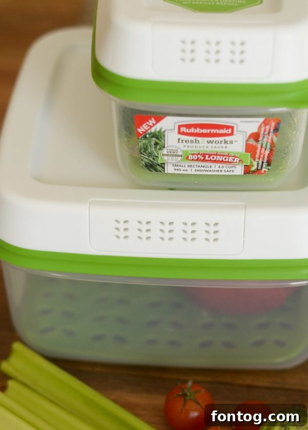 Rubbermaid FreshWorks containers filled with fresh garden produce, showcasing their design and functionality.