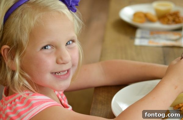 Child learning to set table with Mardi Gras Napkins