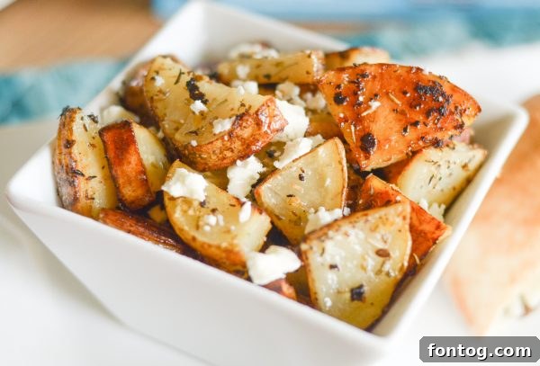 Individual Gyro Slider showcasing its seasoned burger, creamy yogurt cheese, and soft pita pocket, a perfect snack or light meal