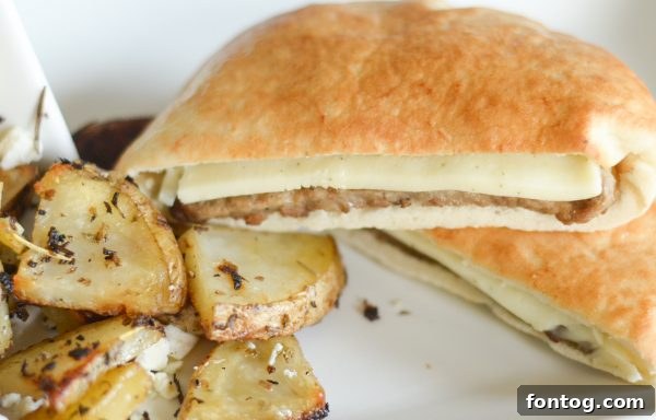 Close-up of the perfectly seasoned and roasted Greek Potatoes, highlighting their texture and appealing color