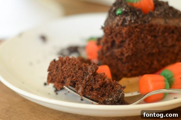 A festive Pumpkin Patch Cake with various candy decorations.