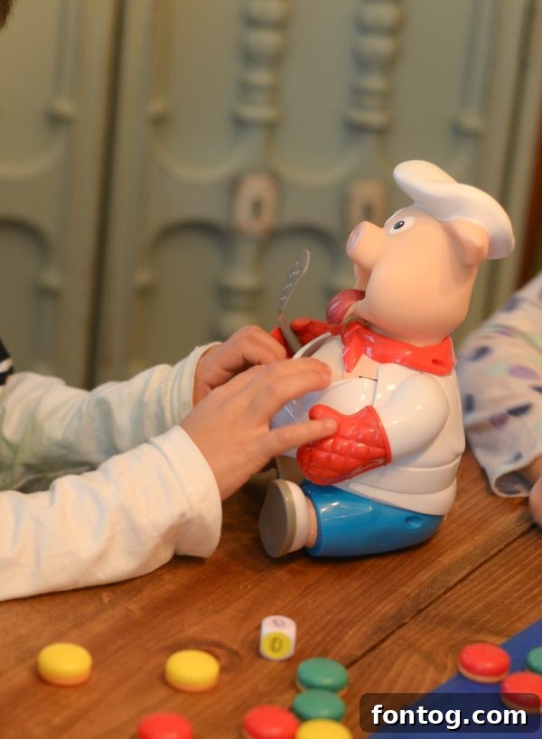 Delicious 'Dirt Worm Cups' dessert, featuring chocolate pudding, cookie crumbles, and gummy worms, themed for Giggle Wiggle. #DessertsForGameNight