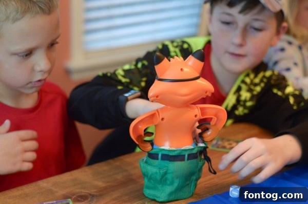 Plate of 'pigs in a blanket' snack, a perfect thematic pairing for the Pop the Pig game. #PartyFood