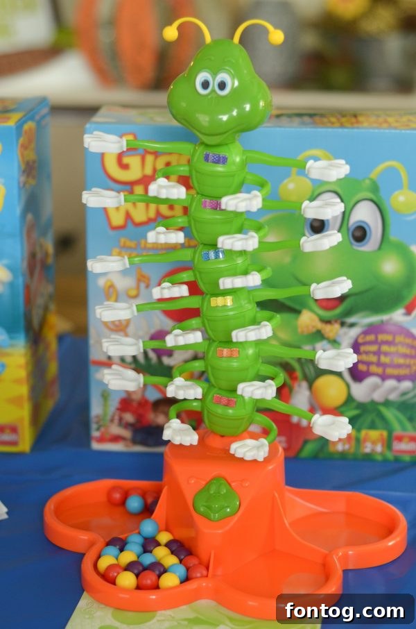 A child happily playing the Shark Bite game, reeling in fish from the shark's mouth with a toy fishing rod. #SharkBiteGame