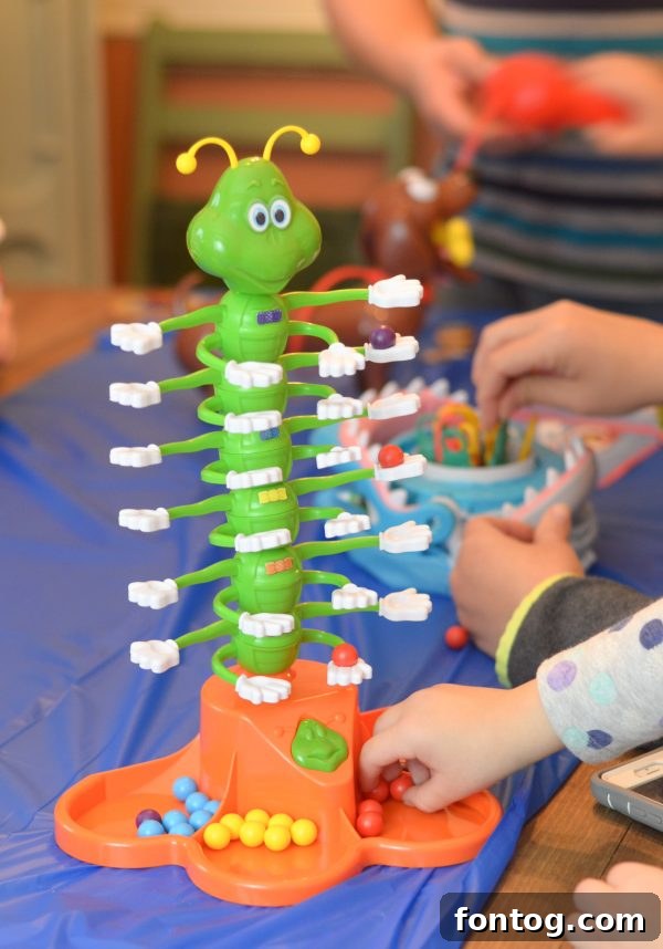 Themed snack bowl with Swedish Fish, pretzels, and chocolate candies, designed to go with the Shark Bite game. #GameNightSnacks