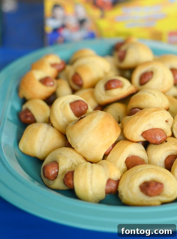 The Giggle Wiggle game in action, showcasing the vibrant caterpillar and marbles being played. #KidsBoardGames