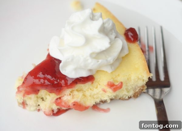 The Cheesecake Factory Bake-at-Home Mixes 6 A beautifully sliced strawberry cheesecake, showing its creamy layers, made effortlessly with Cheesecake Factory At Home Mixes