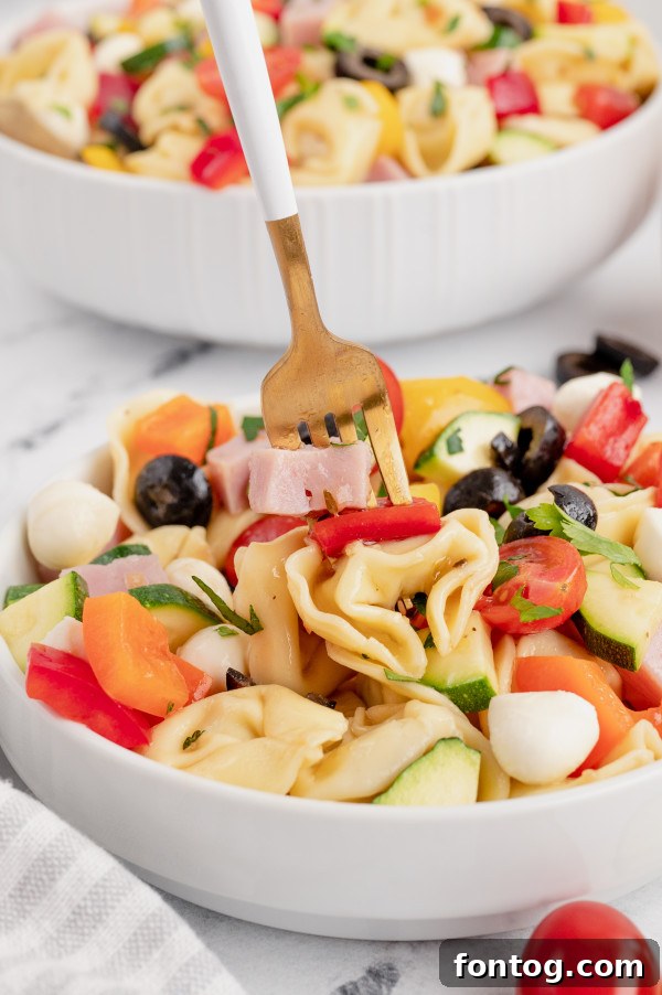 Ready-to-serve tortellini pasta salad in a large serving bowl