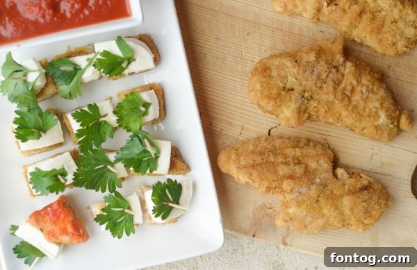 Festive Parmesan Herb Bites 4 Ingredients for Parmesan Herb Bites, including Tyson chicken strips and fresh mozzarella.