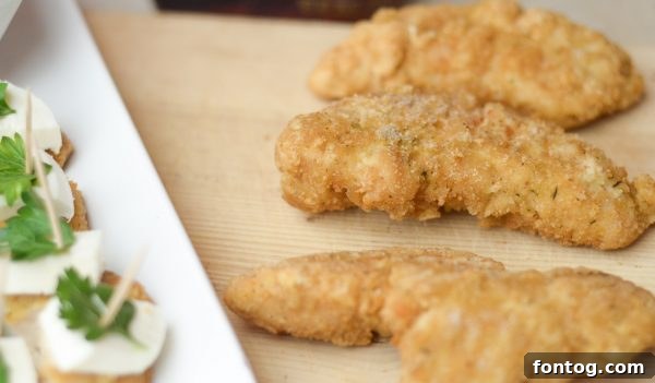 Festive Parmesan Herb Bites 5 Preparing Parmesan Herb Bites: chicken strips, cheese, and parsley ready to be assembled.