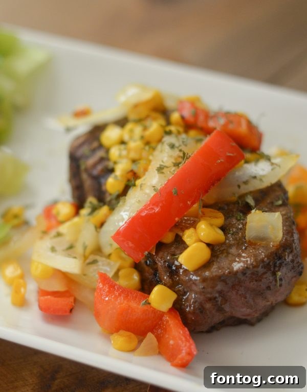 Filet Mignon with colorful veggie topping, ready to serve