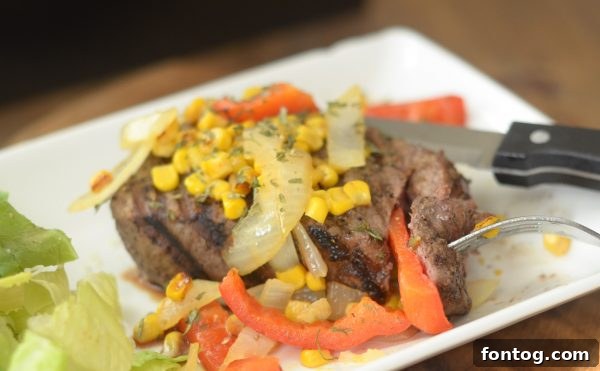 Prepared Filet Mignon with sautéed vegetables, ready for a close-up