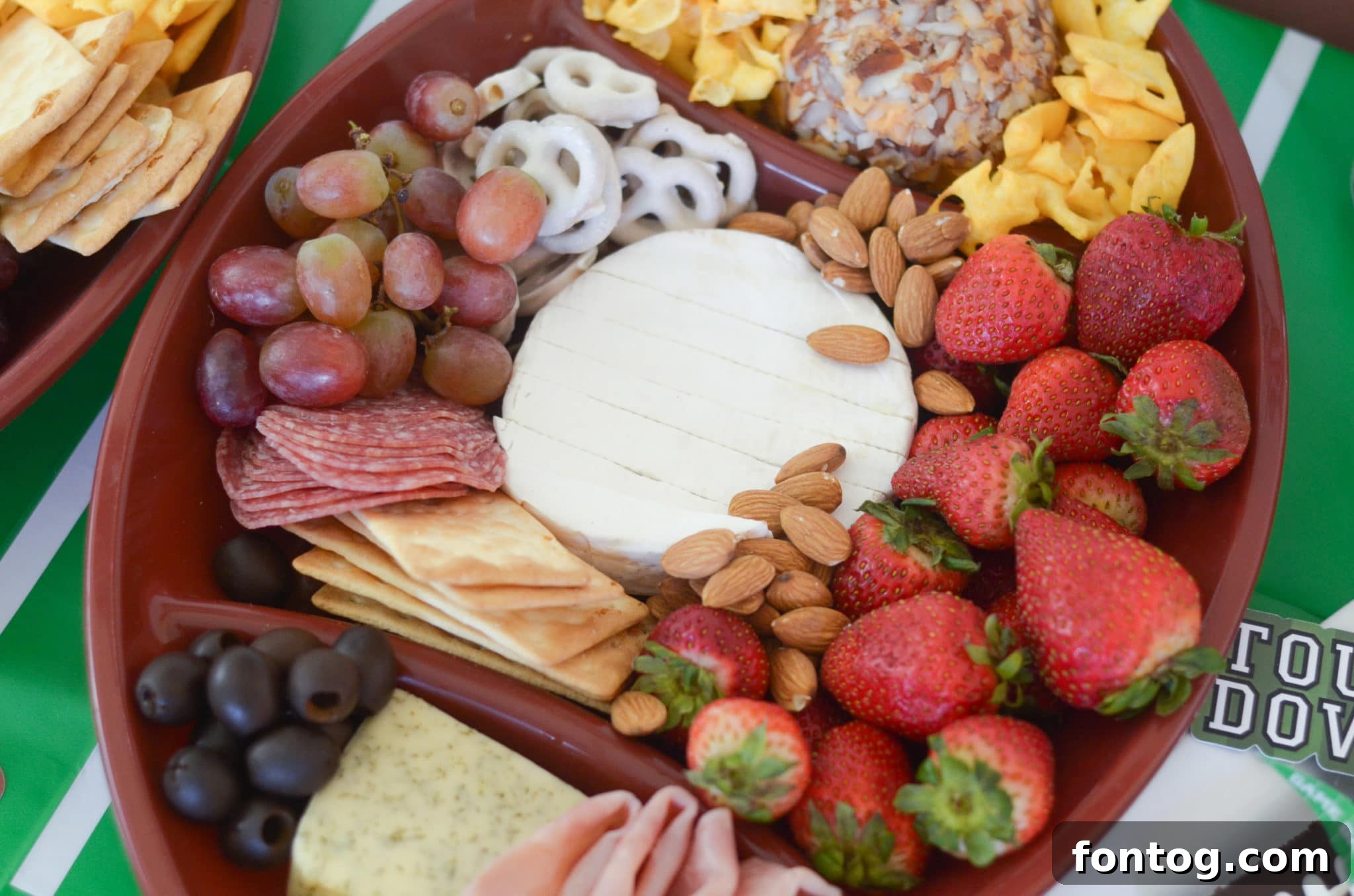 Assembling a football-shaped cheese board