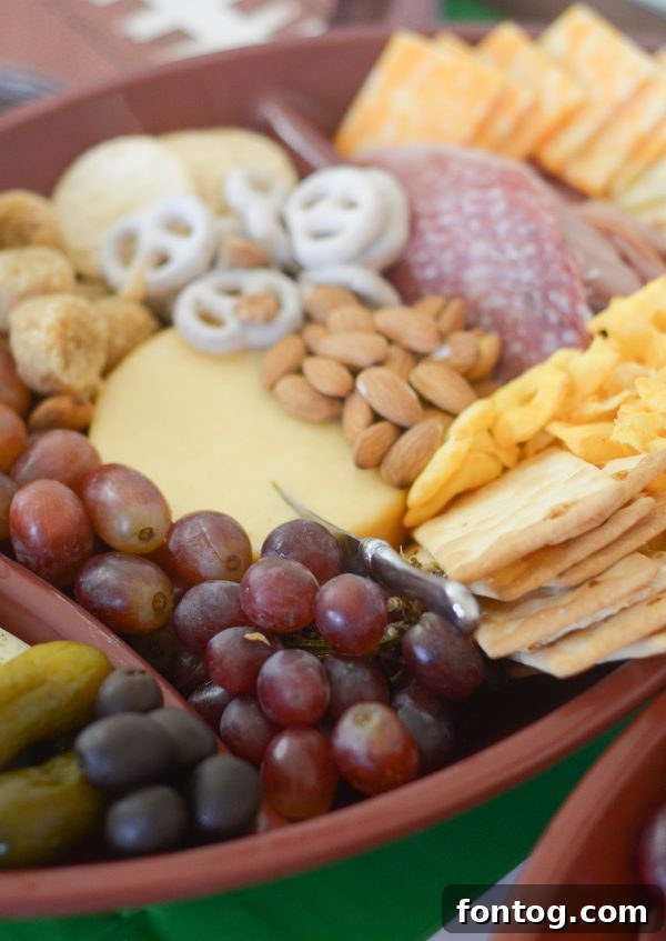 Touchdown Bites: Hosting the Ultimate Homegate with a Football Cheese Board 9 Finished football cheese board with almonds and fruit