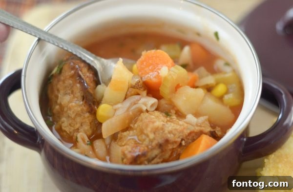 Cozy Instant Pot Meatball Soup 5 Serving Instant Pot Meatball Soup in a bowl, garnished with fresh herbs.