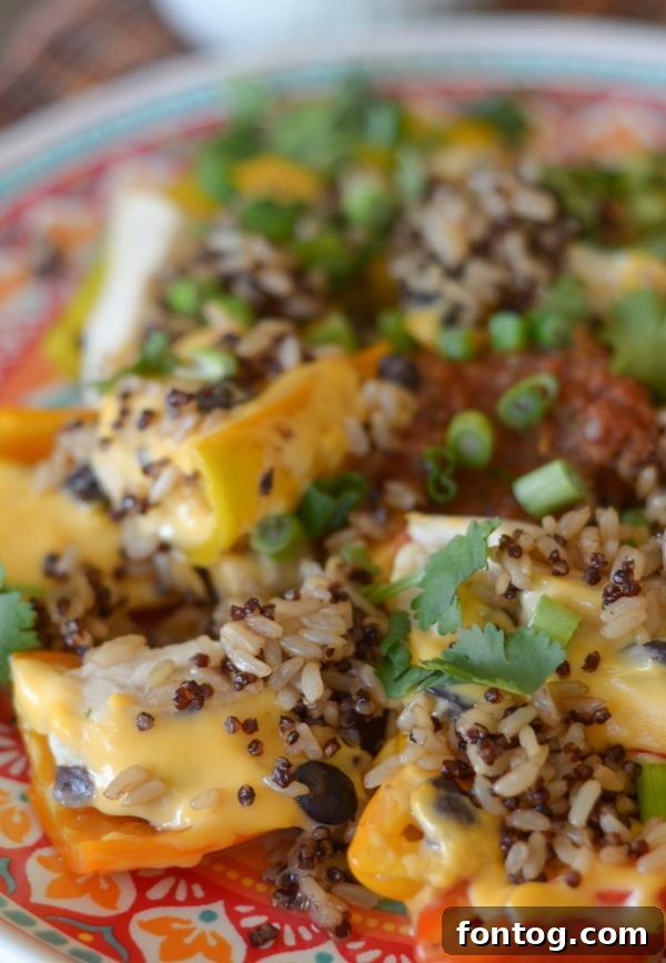 Full cast iron skillet of Cheesy Sweet Pepper Nachos ready to be served.