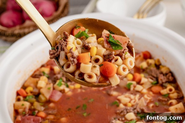 Close-up of fresh vegetables being added to an Instant Pot for soup