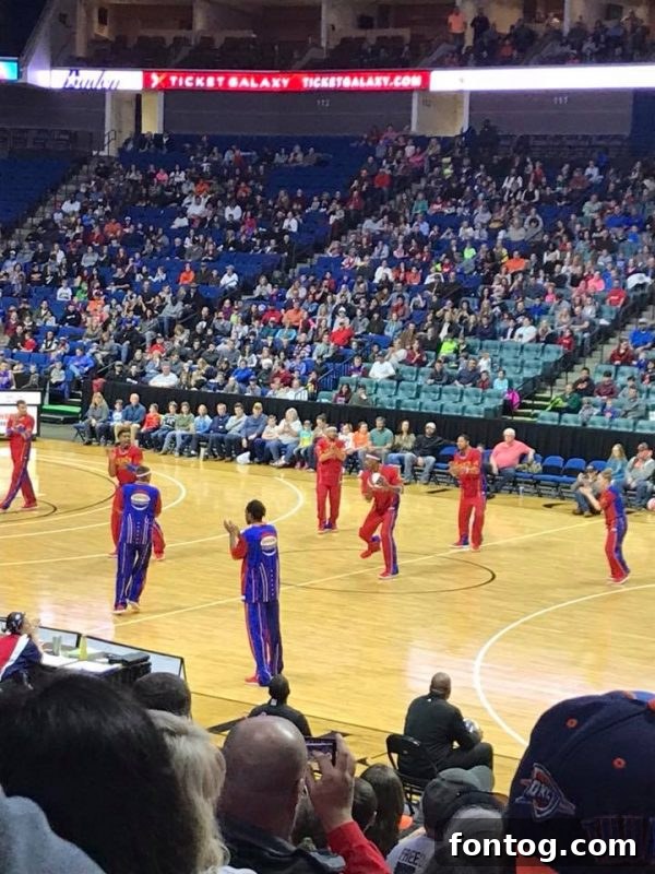 Child getting an autograph from a Harlem Globetrotters player
