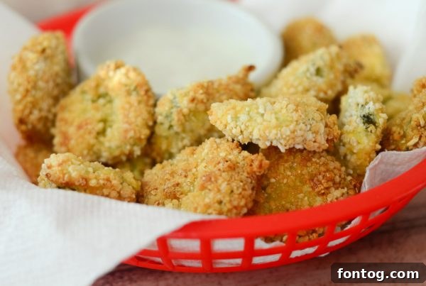 Platter of Air Fryer Fried Pickles served with a side of creamy ranch dressing, perfect for dipping.
