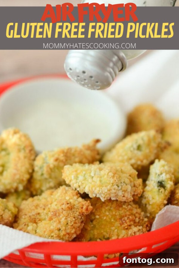 A beautifully presented plate of Air Fryer Fried Pickles with a small bowl of ranch dipping sauce, garnished for serving.