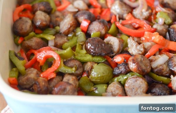 A plate of air-fried bratwurst and vegetables, beautifully plated