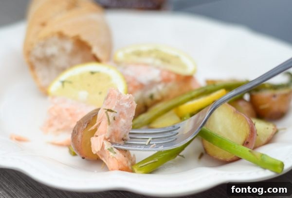 Happy family enjoying an outdoor meal with grilled salmon and sweet tea