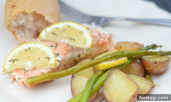 Grilled salmon cooking on the barbecue with lemon slices