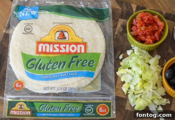 Air Fryer Tostada with meat and beans before adding fresh toppings.