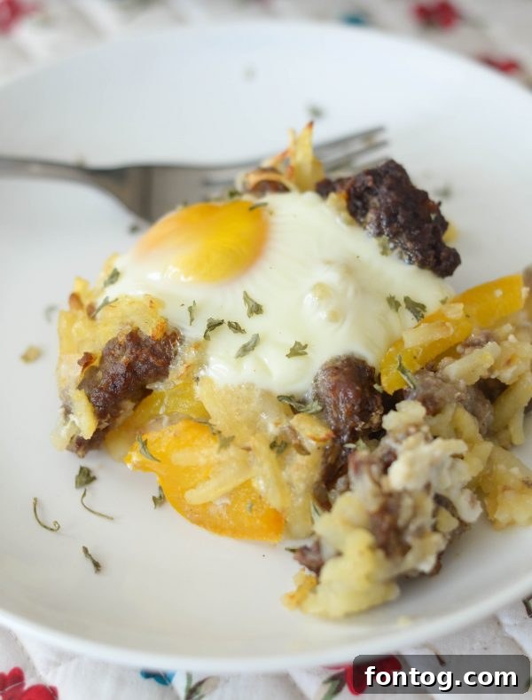 Hearty Air Fryer Sausage Breakfast Casserole with hash browns, eggs, peppers, and onions