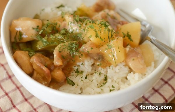 Crispy gluten-free sweet and sour chicken served in a bowl, made in an air fryer.