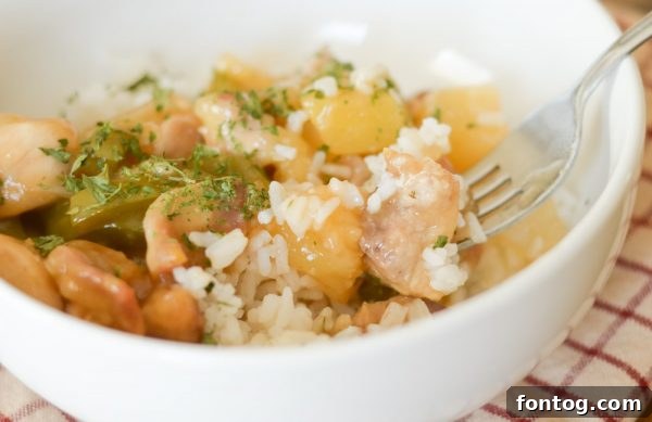 Air-fried gluten-free sweet and sour chicken with vibrant sauce, ready to serve.