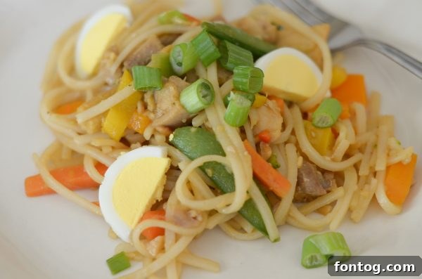 A serving of Gluten Free Chicken Pad Thai ready to be enjoyed