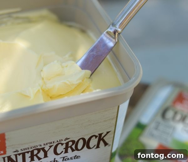 10 Summer Cookout Menu Staples for a Flawless Feast 8 Preparing a homemade peach cobbler, a sweet dessert for a summer gathering. #SummerCookout #MasterSummer