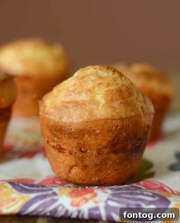Irresistible Ham and Cheese Popovers 4 A young girl happily assisting her mother in the kitchen, mixing ingredients for a recipe.