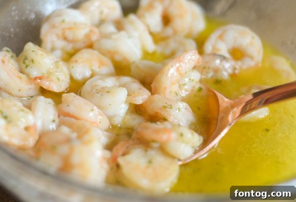 Cooked Gorton's Simply Bake Shrimp scampi, glistening with buttery garlic sauce.