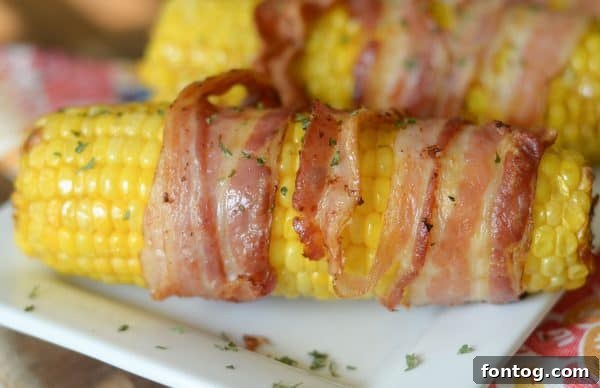 Air Fryer Bacon Wrapped Corn on the Cob, golden and crispy