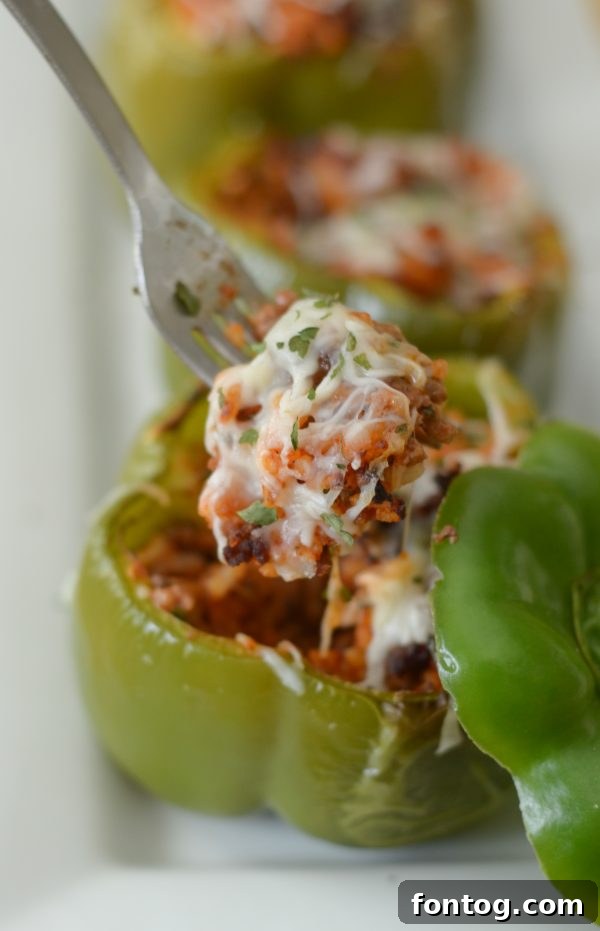 Crispy Air Fryer Stuffed Peppers 4 Air Fryer Stuffed Peppers arranged in the air fryer basket