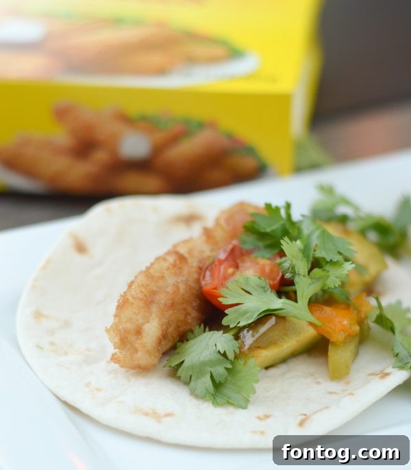 A close-up of Crispy Fish Street Tacos, showcasing their delicious toppings