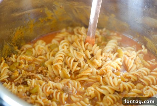 Freshly cooked Gluten-Free Instant Pot Taco Pasta with garnishes