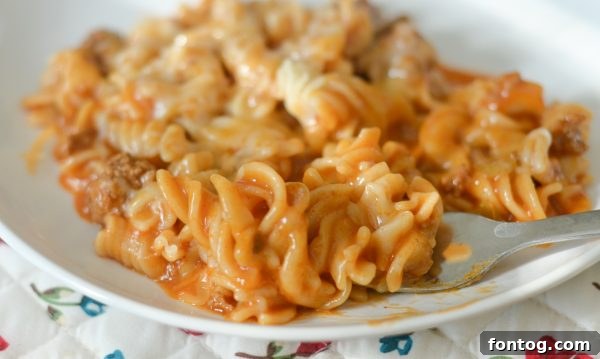Instant Pot filled with uncooked ingredients for taco pasta