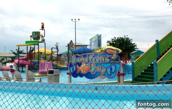 Kids Enjoying White Water Bay Wave Pool and Slides