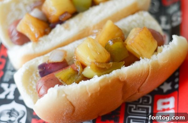 A beautifully presented Hawaiian Hot Dog on a bun