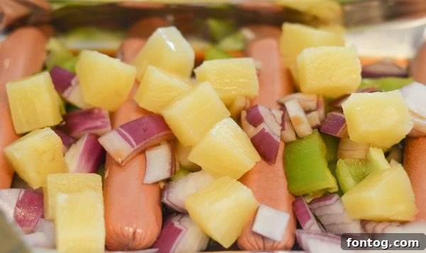 Grilled Hawaiian Hot Dogs being served on a plate